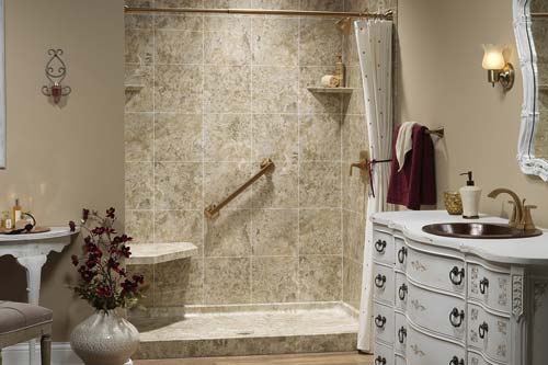 Tan walled bathroom with tan tiled shower.