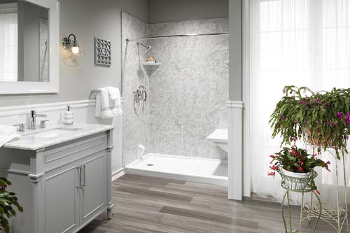 White and gray accented bathroom with walkin shower.