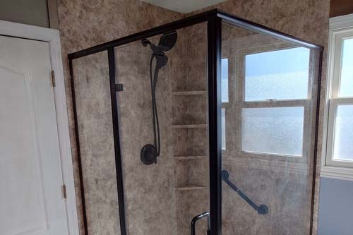 Enclosed Shower with glass walls.